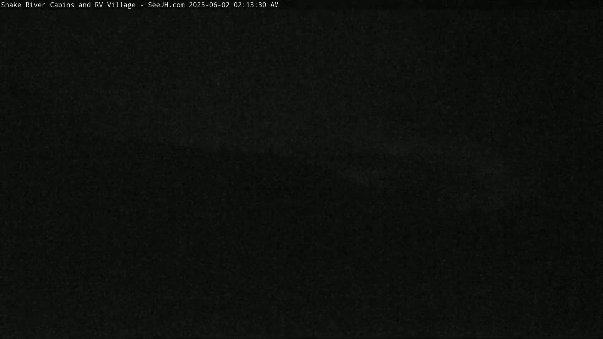 The image shows a completely dark scene at night.