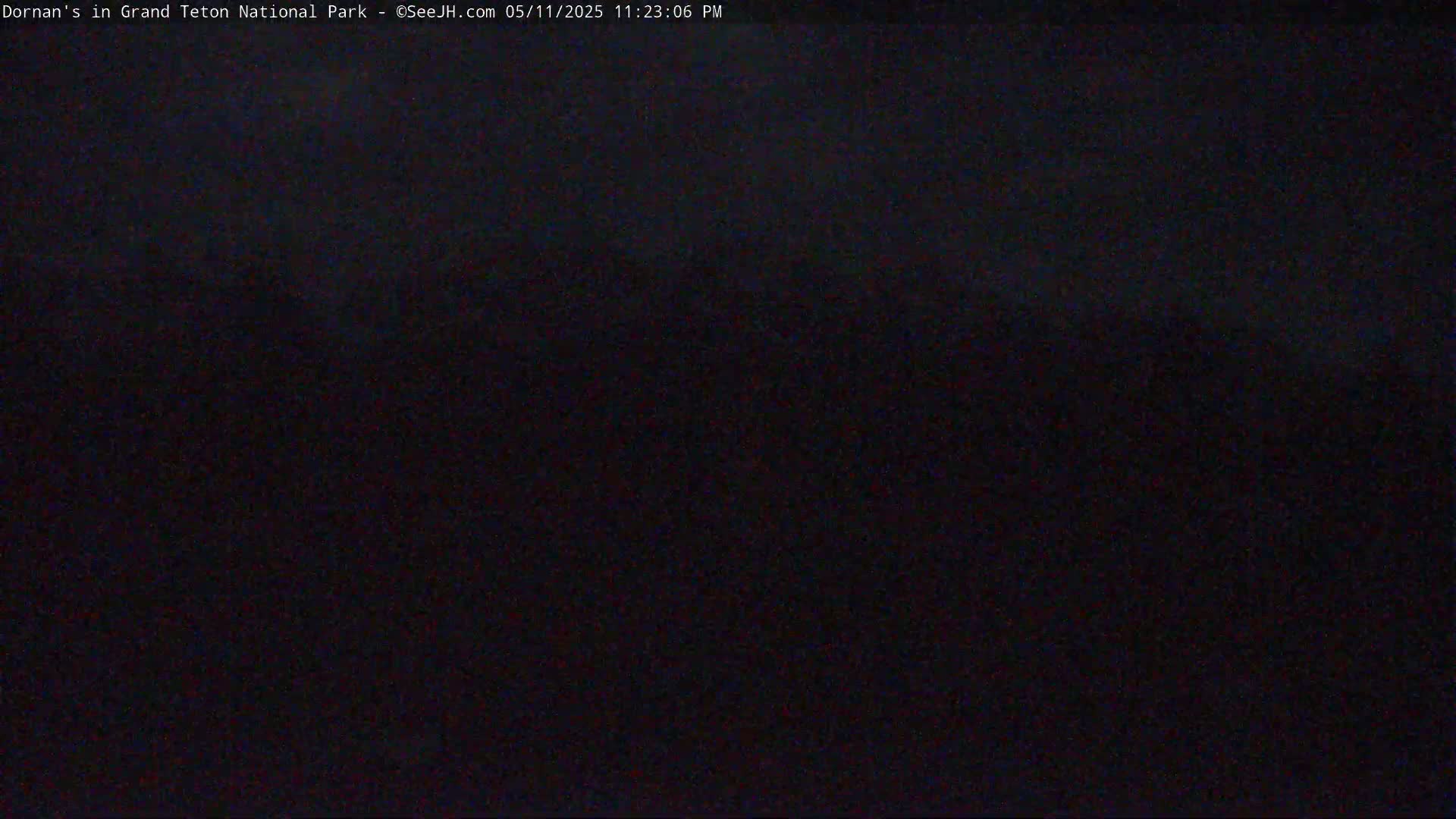 A completely dark image, likely taken at night outdoors.