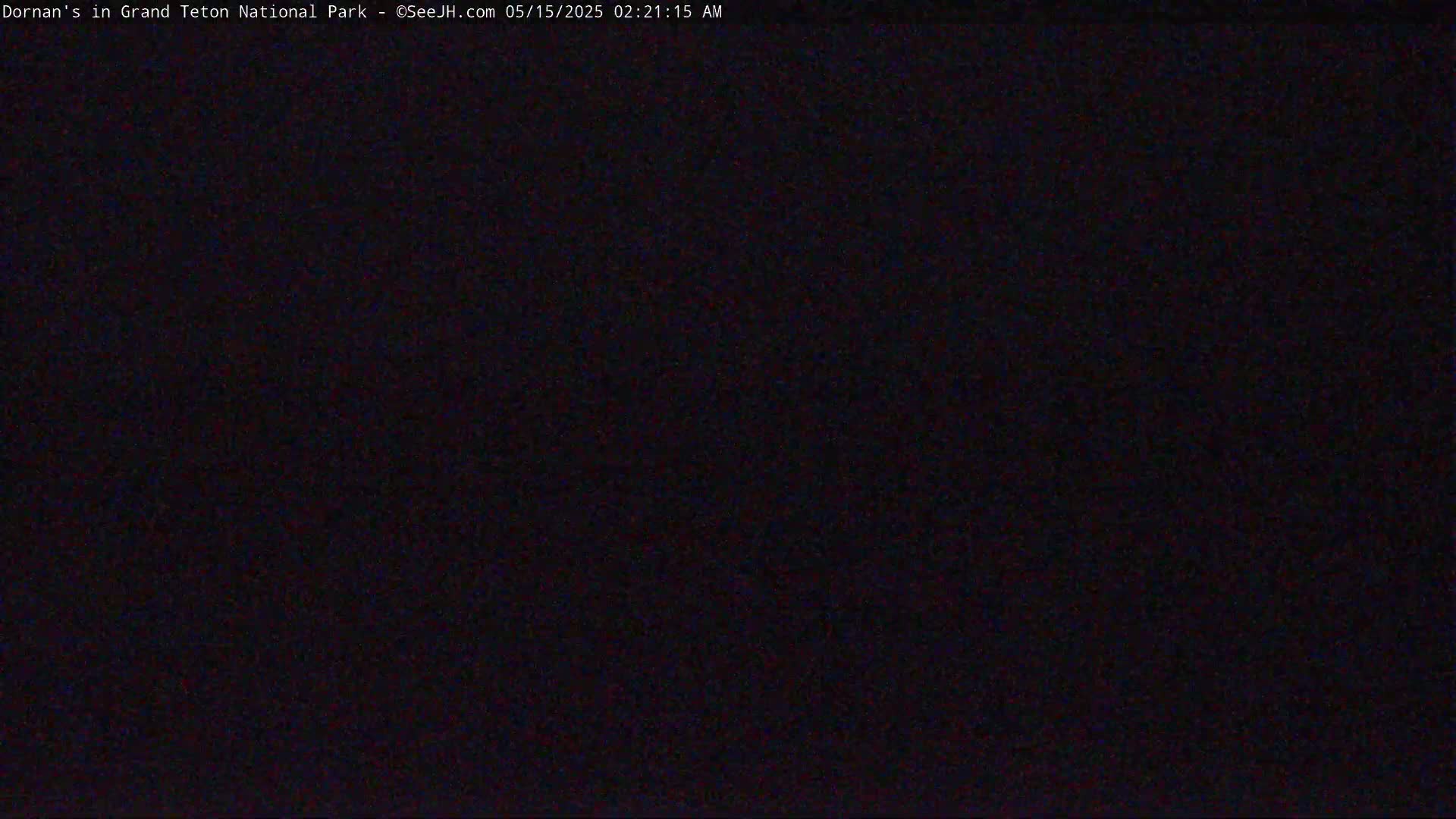 The image shows a completely dark scene at night.