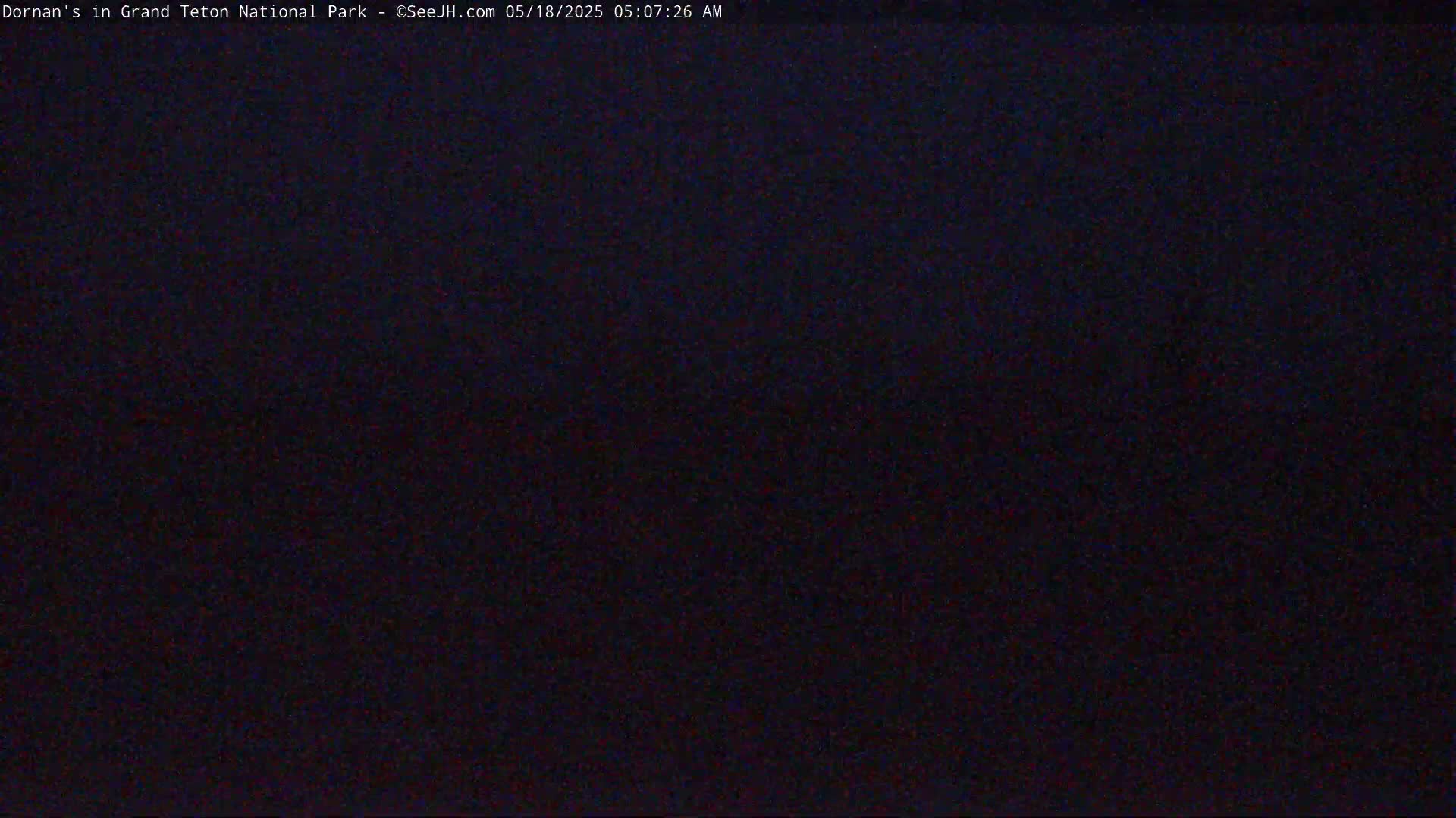 A completely dark image is visible, suggesting nighttime conditions.