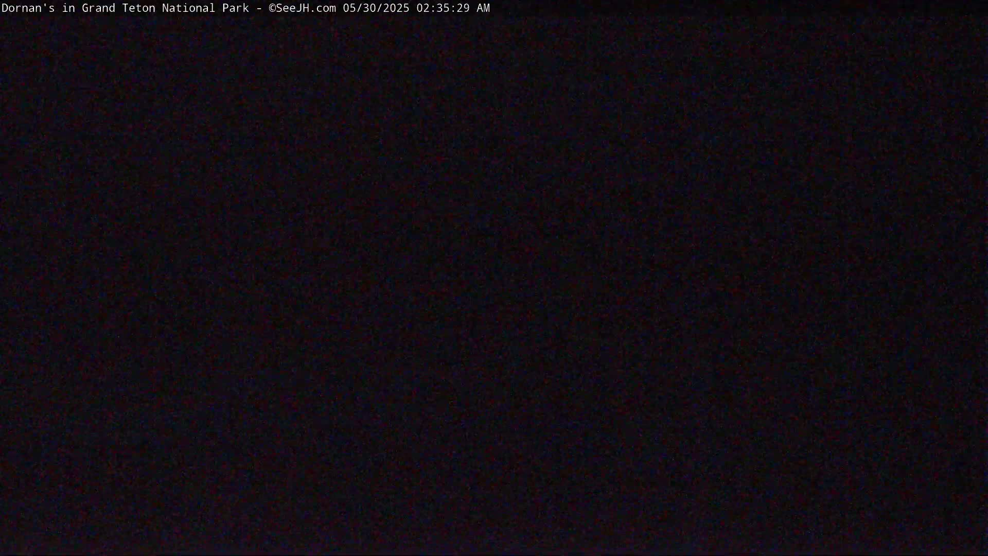 The image shows a completely dark scene at night.