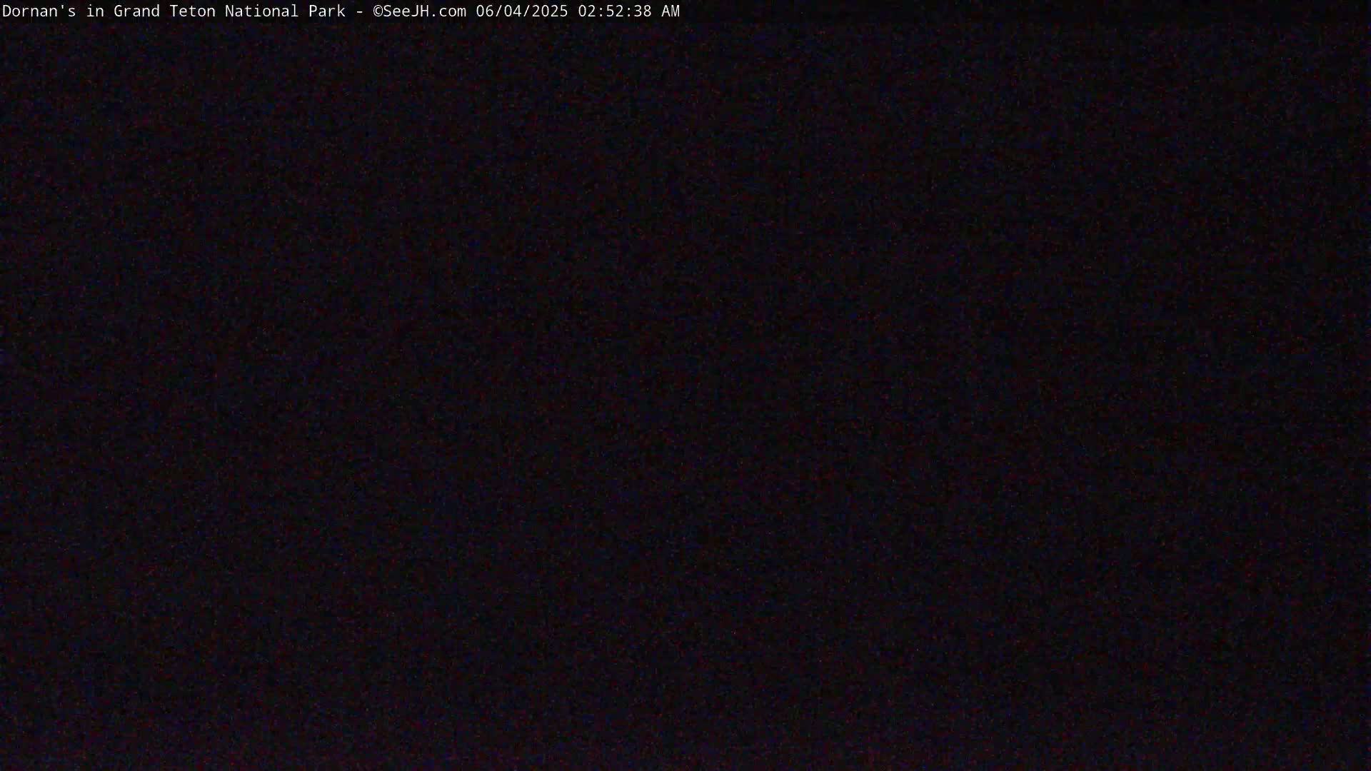 The image shows a completely dark scene at night.