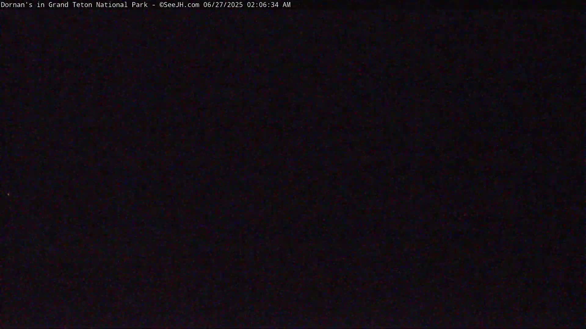 The image shows a completely dark scene at night.
