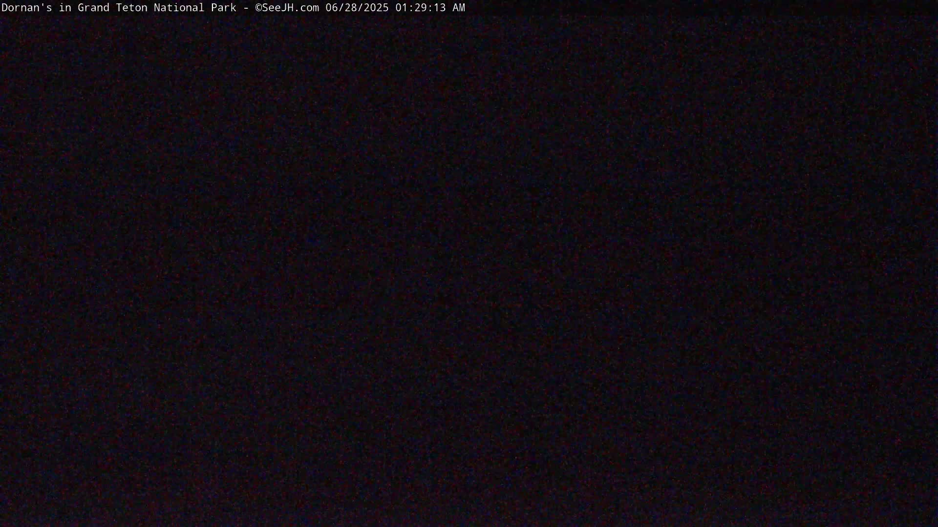 The image shows a completely dark scene at night.