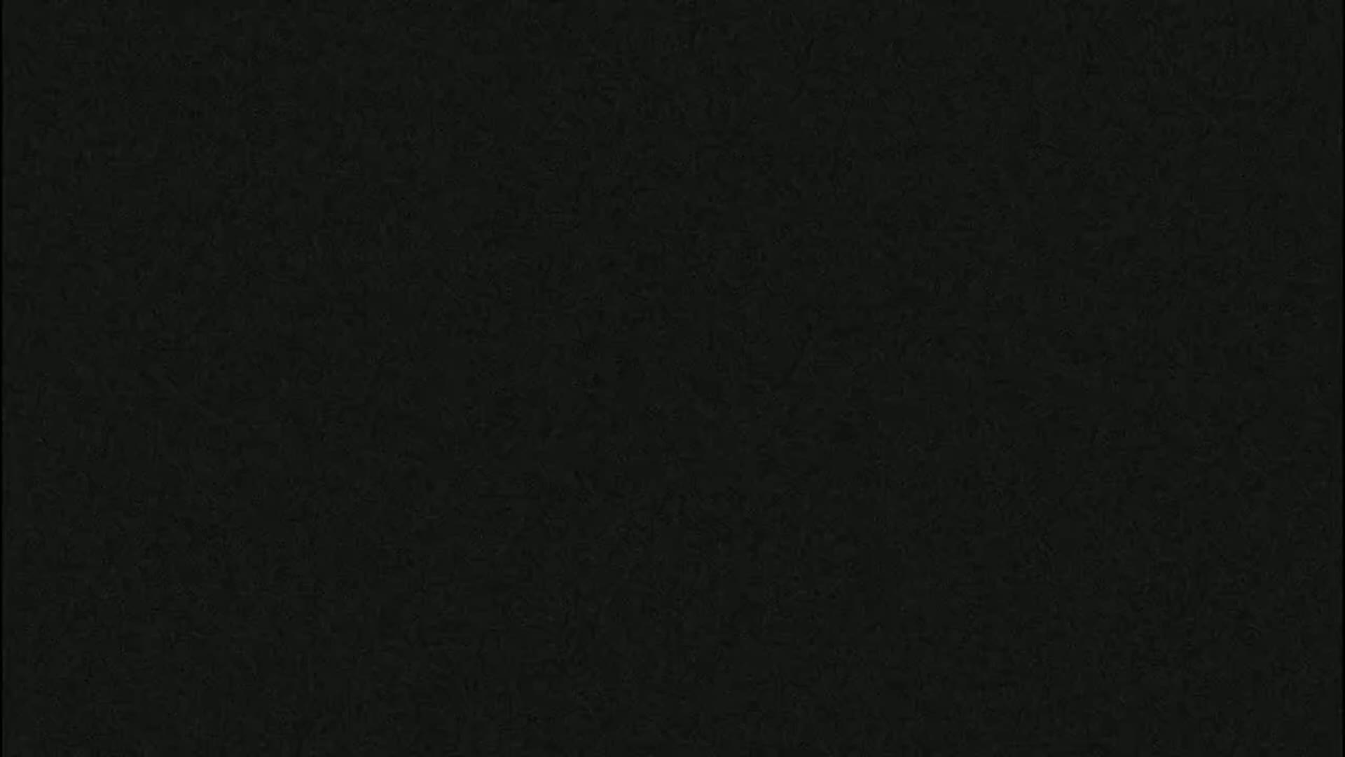 The image is a solid dark-grey/black textured background.