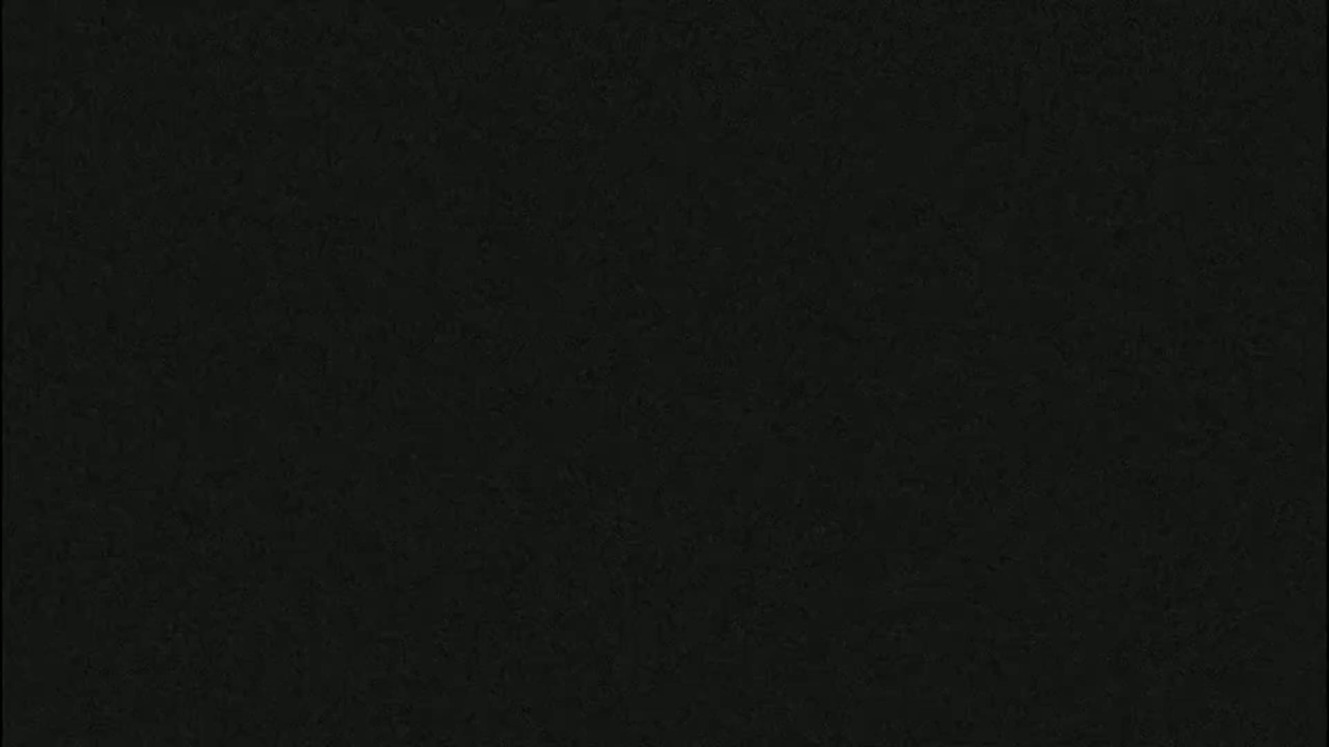 The image is a solid dark-grey/black color with a slightly textured appearance.