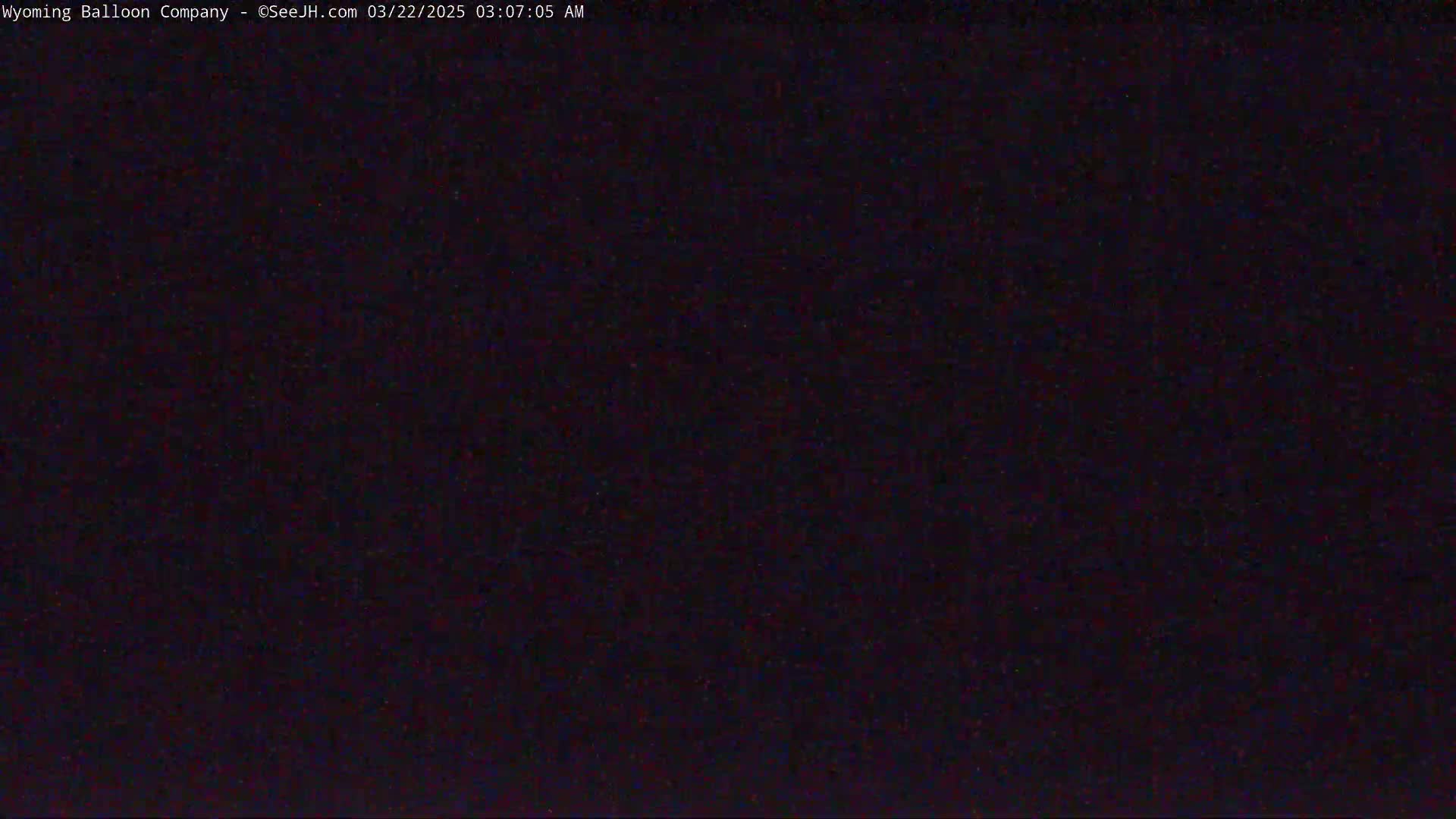 The image shows a completely dark scene at night.