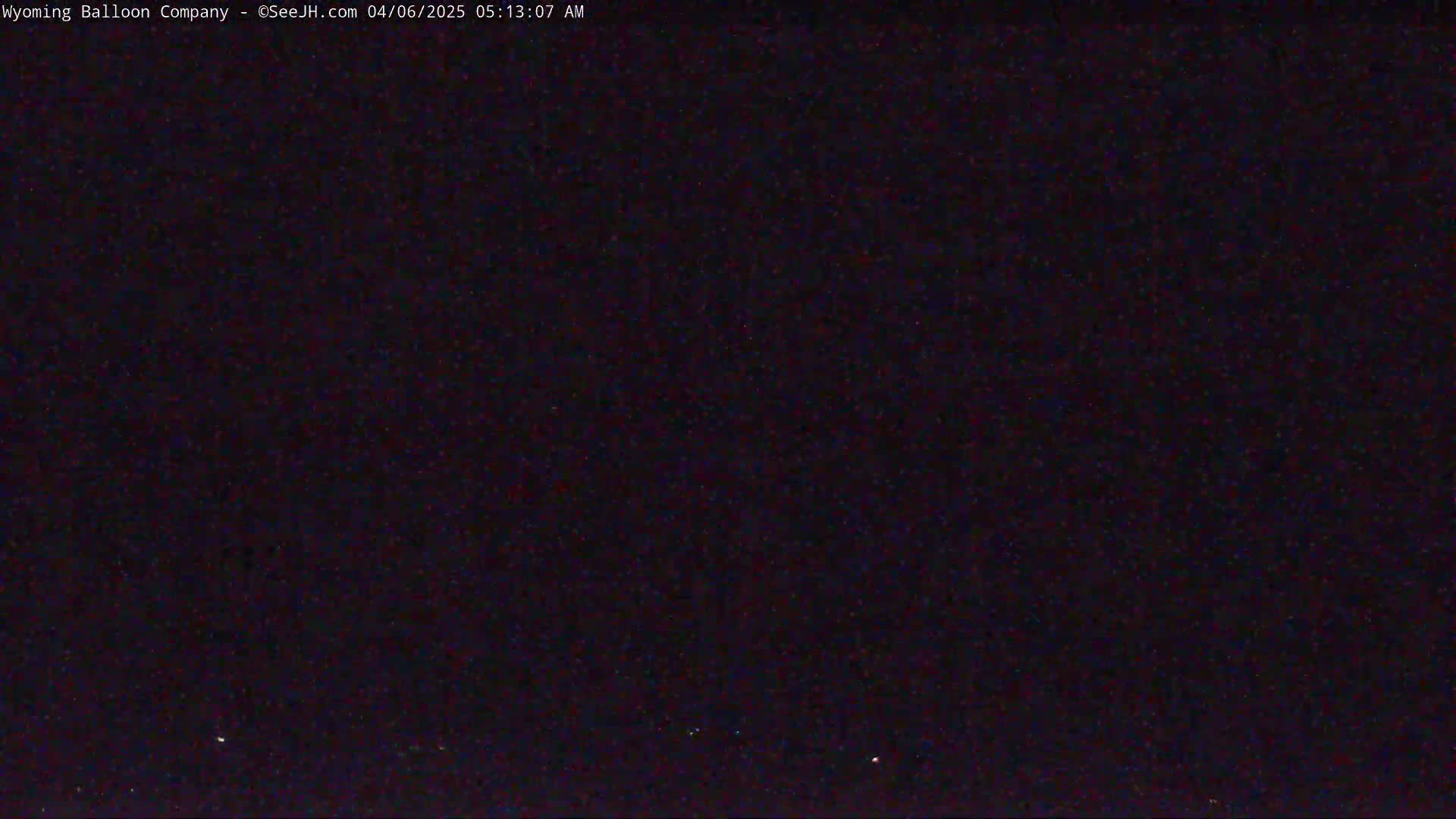 A dark, nighttime sky is visible, speckled with a few faint lights.