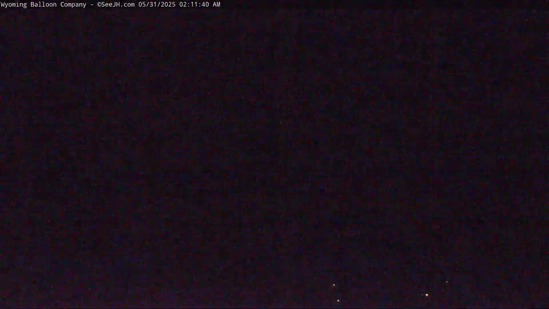 A dark night sky is visible, showing a few faint stars.