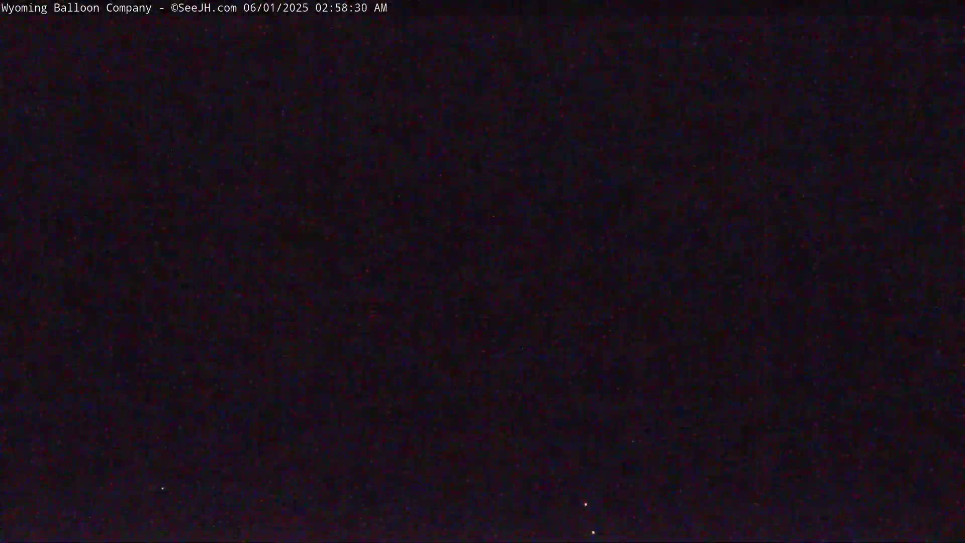 A dark nighttime sky shows a few faint stars.