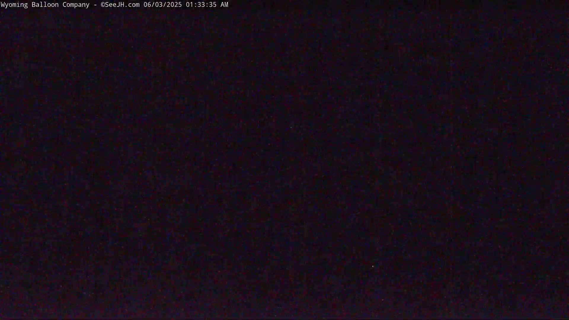 The image is a completely dark, nighttime scene.