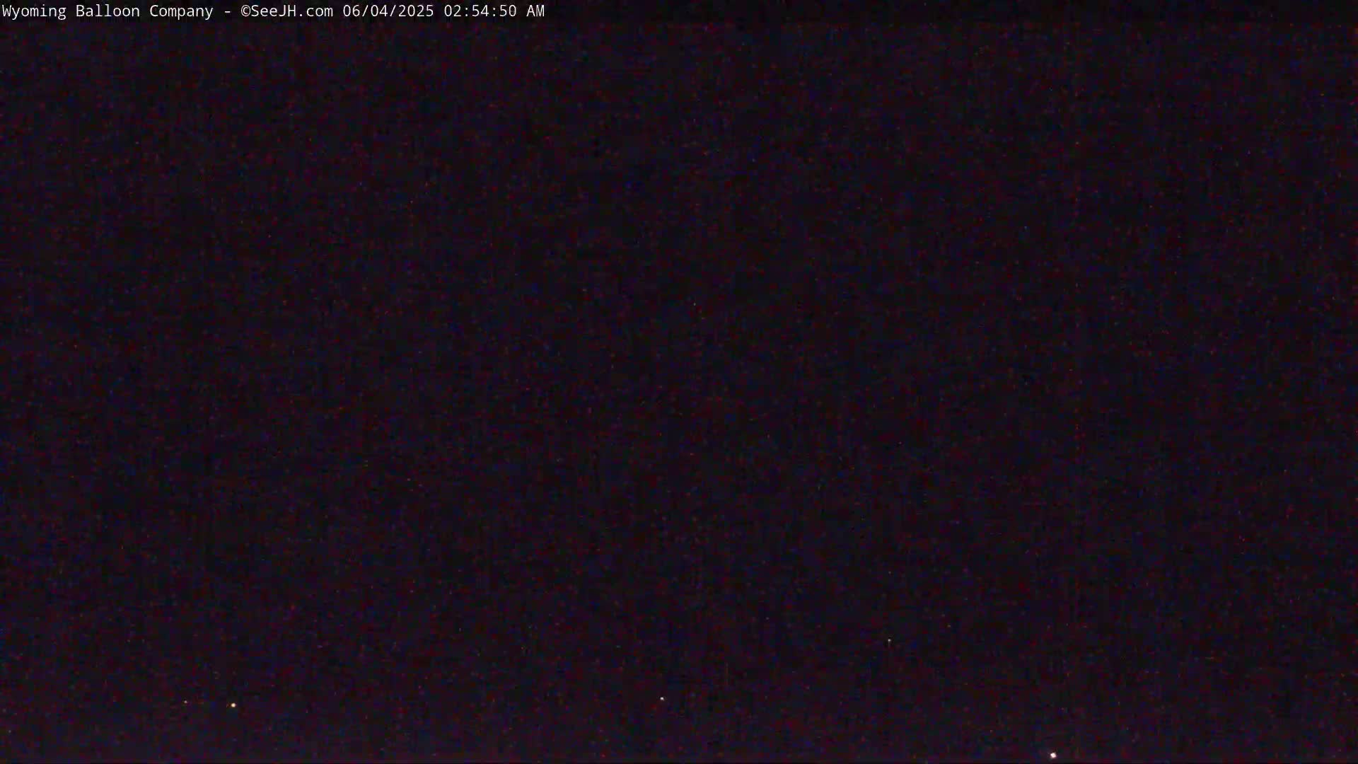 A nighttime view of a dark sky speckled with stars.