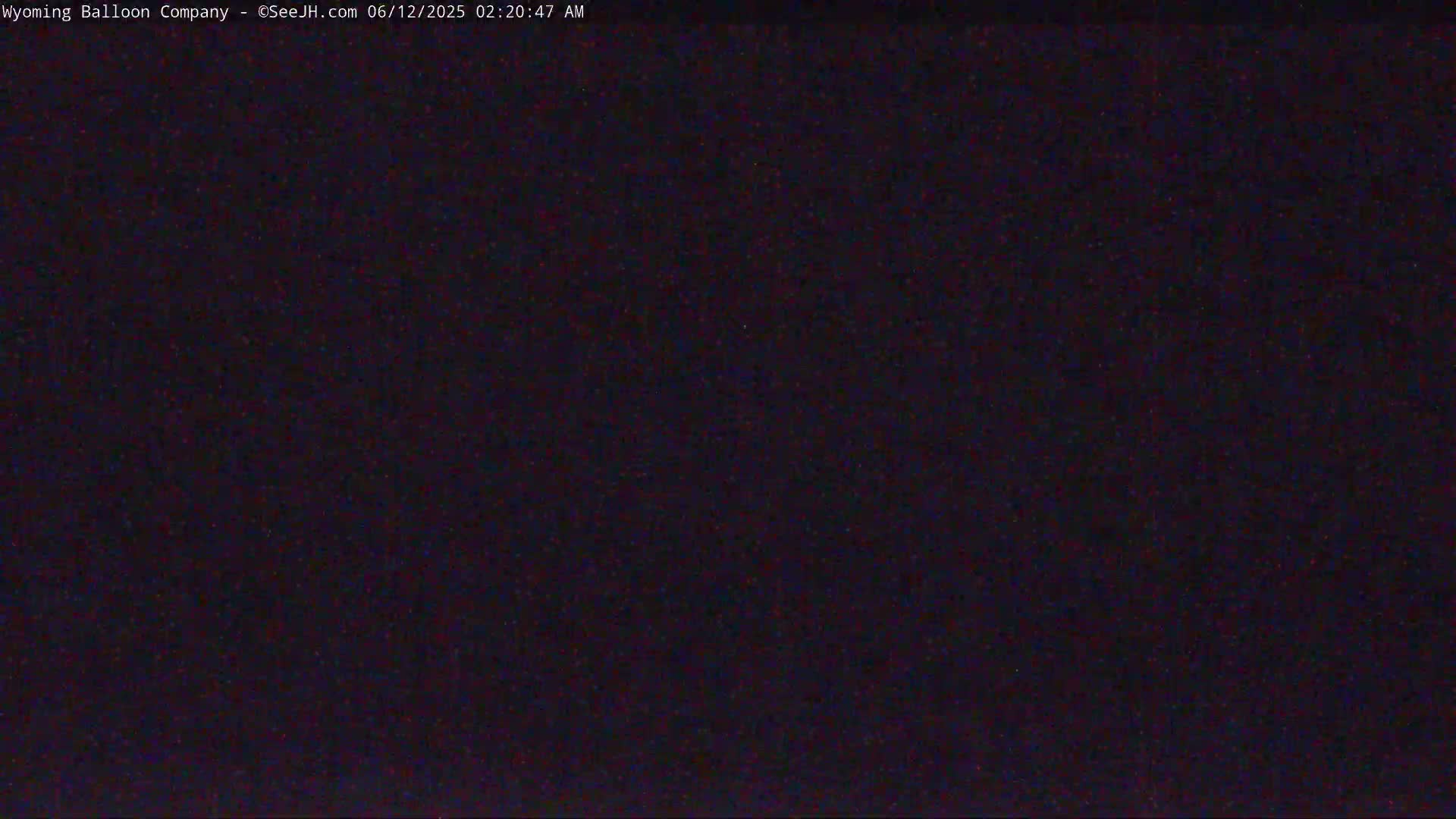 The image shows a dark, grainy view, likely at night.