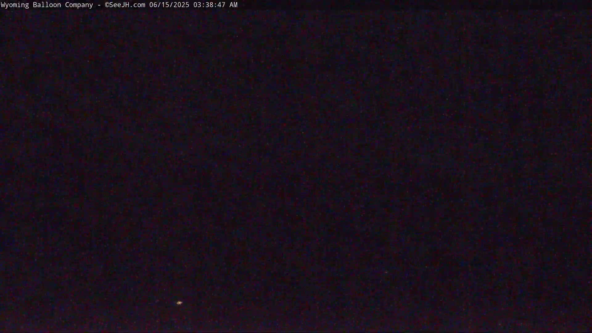 A nighttime outdoor scene shows a dark sky with a few visible stars.