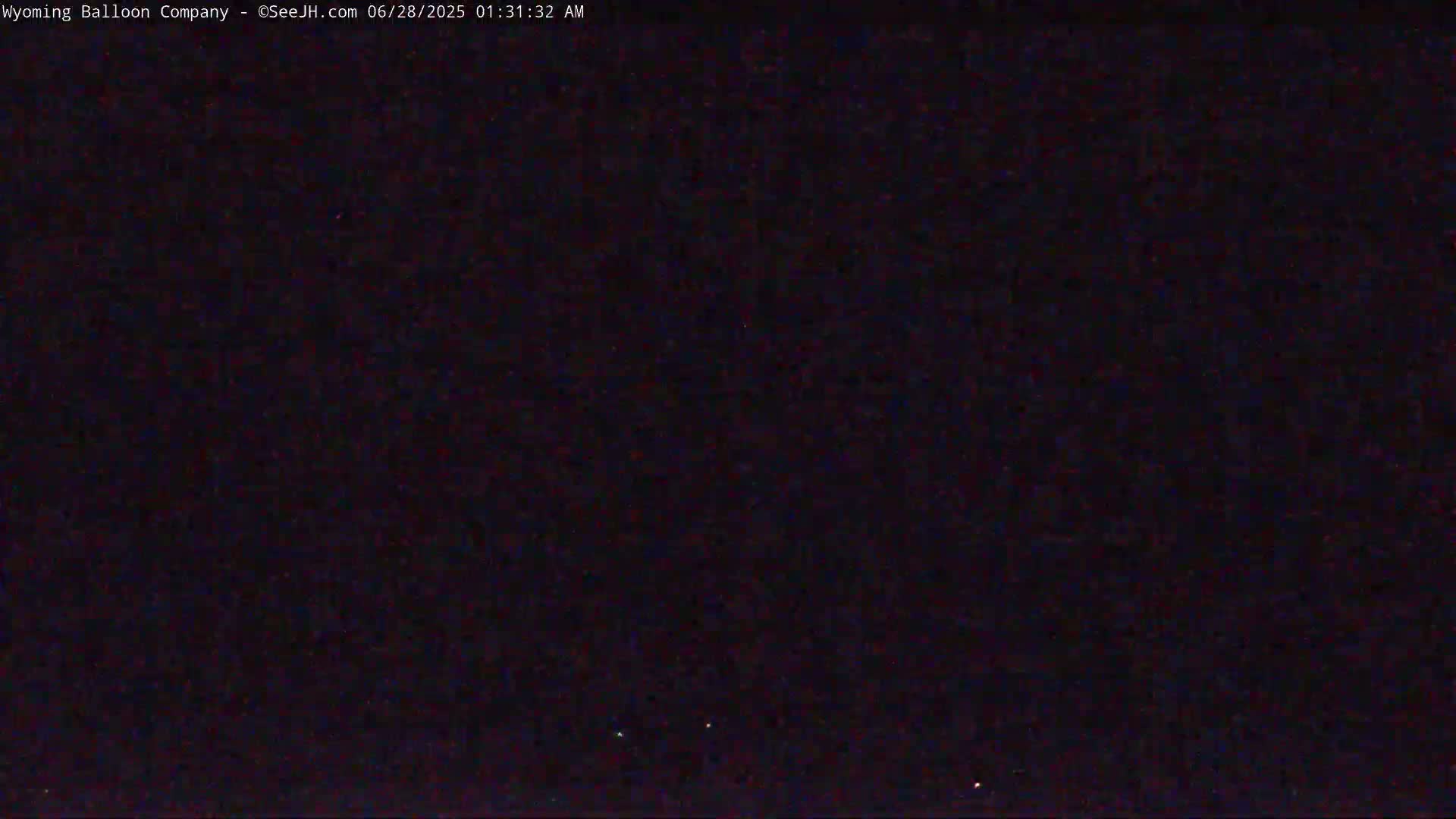 A dark, nighttime sky is visible with a few faint stars.
