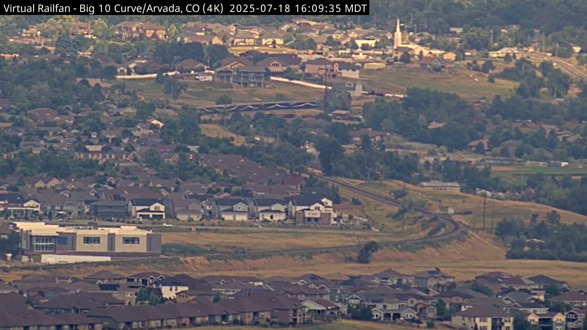 Denver Skyline  & Arvada Big  10 Curve Railroad Live Cam - Arvada, Jefferson, Colorado, USA