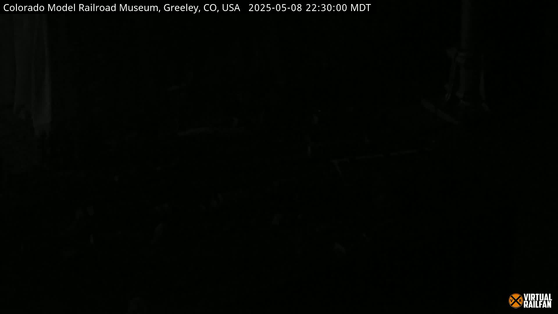 A very dark image shows an indistinguishable scene at night.