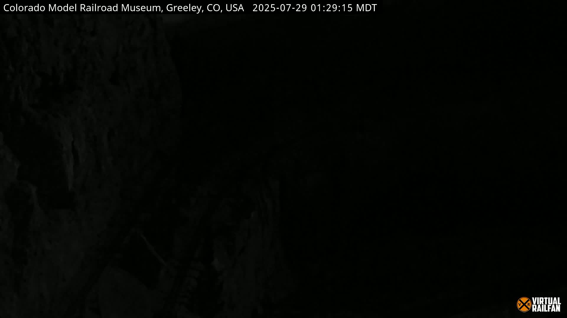 A dark, blurry image shows an indistinct, possibly rocky, surface.