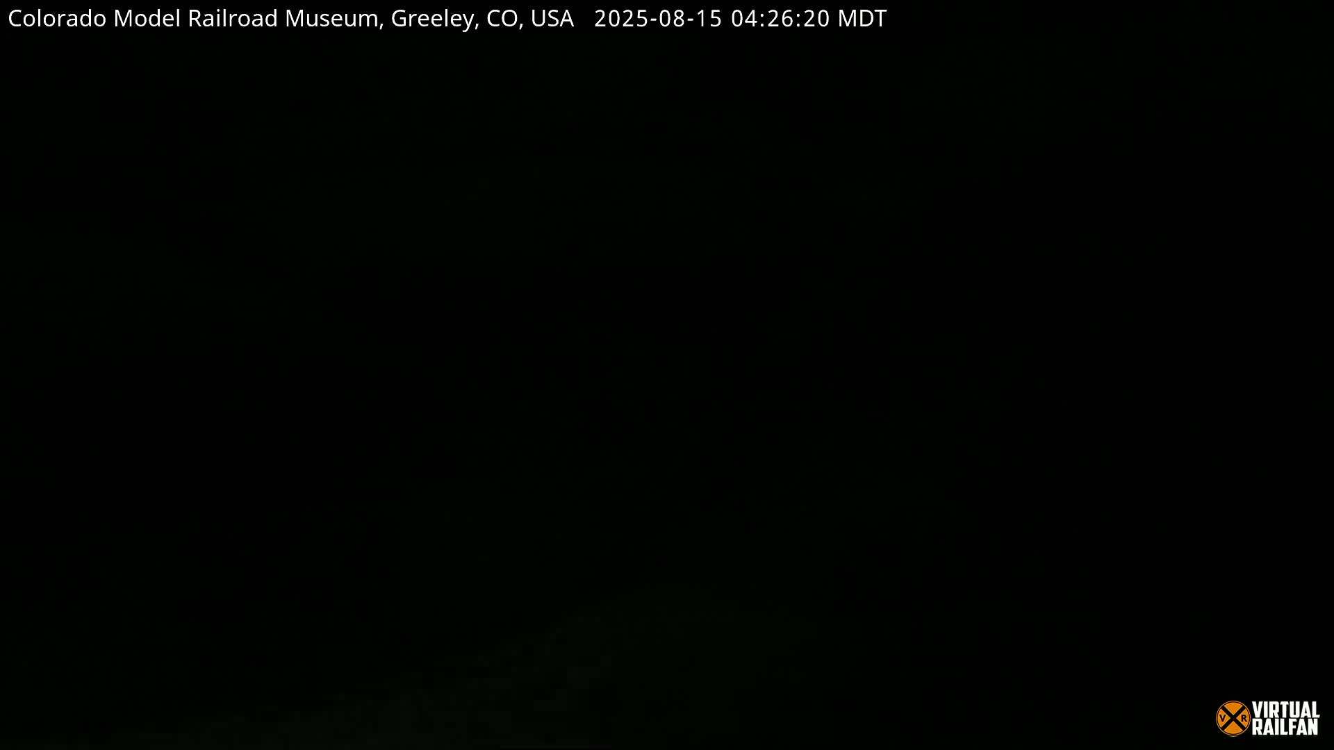 A dark, blurry image shows an indistinct, possibly rocky, surface.