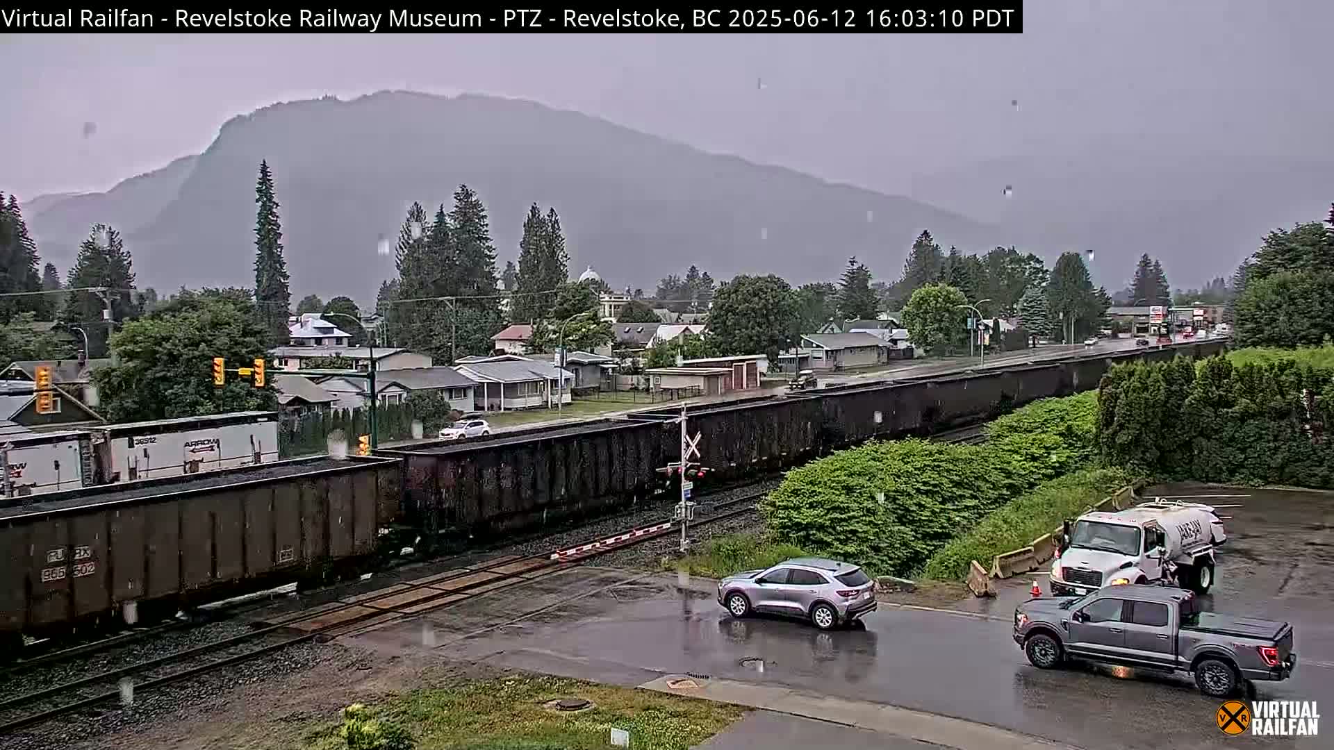 Revelstoke City & Canadian Pacific Railway Railroad Crossing Live Cam - Revelstoke, Columbia-Shuswap, British Columbia, Canada  PTZ | Virtual Railfan LIVE ! 2025-03-18 12:14