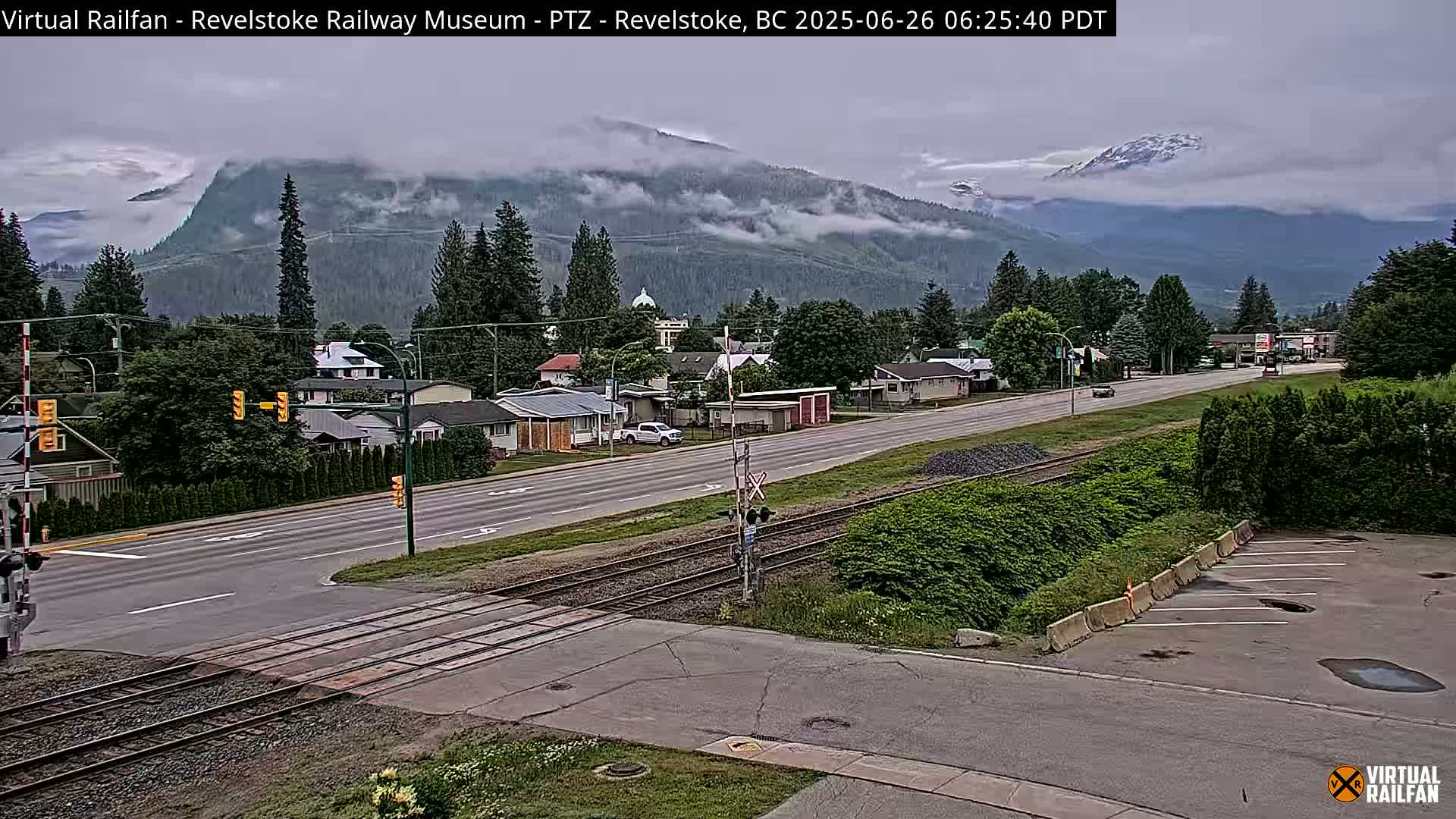 Revelstoke City & Canadian Pacific Railway Railroad Crossing Live Cam - Revelstoke, Columbia-Shuswap, British Columbia, Canada  PTZ | Virtual Railfan LIVE ! 2025-03-18 12:14