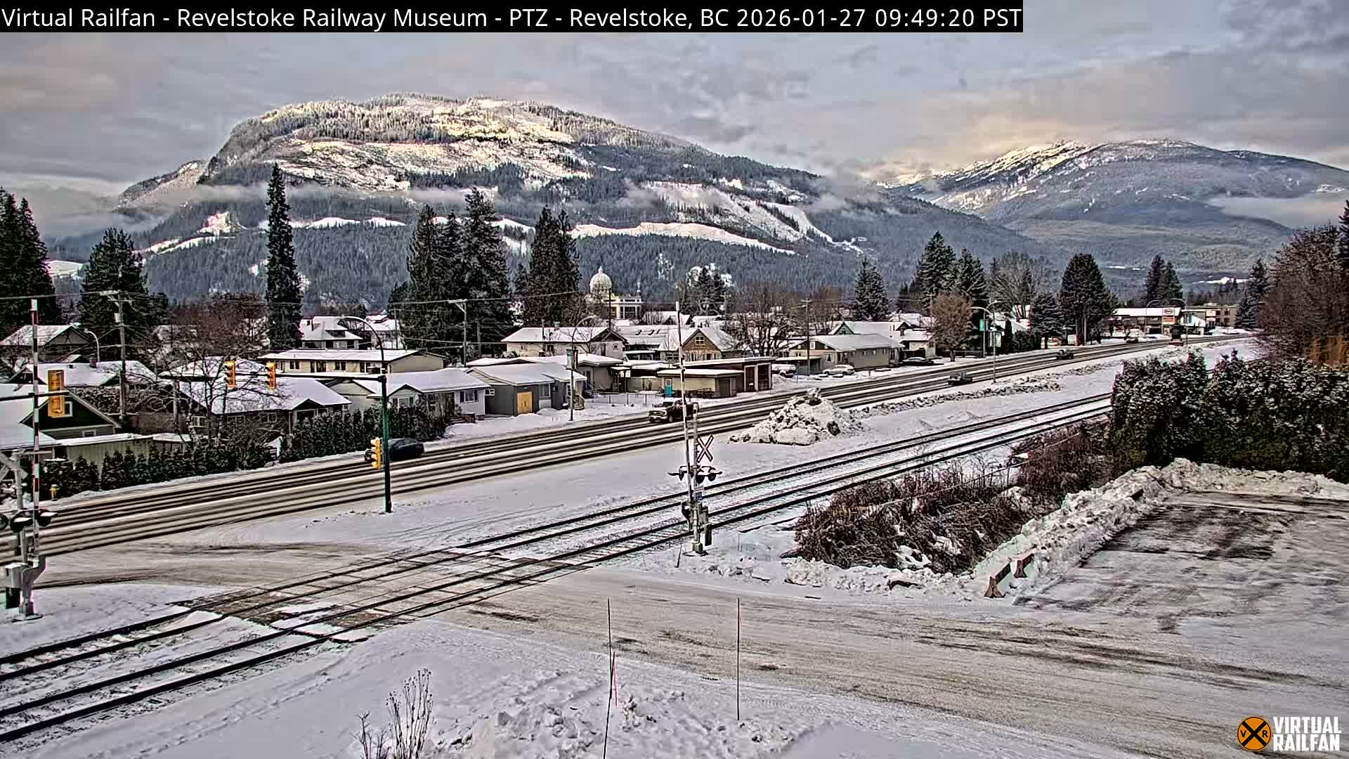 Revelstoke City & Canadian Pacific Railway Railroad Crossing Live Cam - Revelstoke, Columbia-Shuswap, British Columbia, Canada  PTZ | Virtual Railfan LIVE ! 2025-03-18 12:14