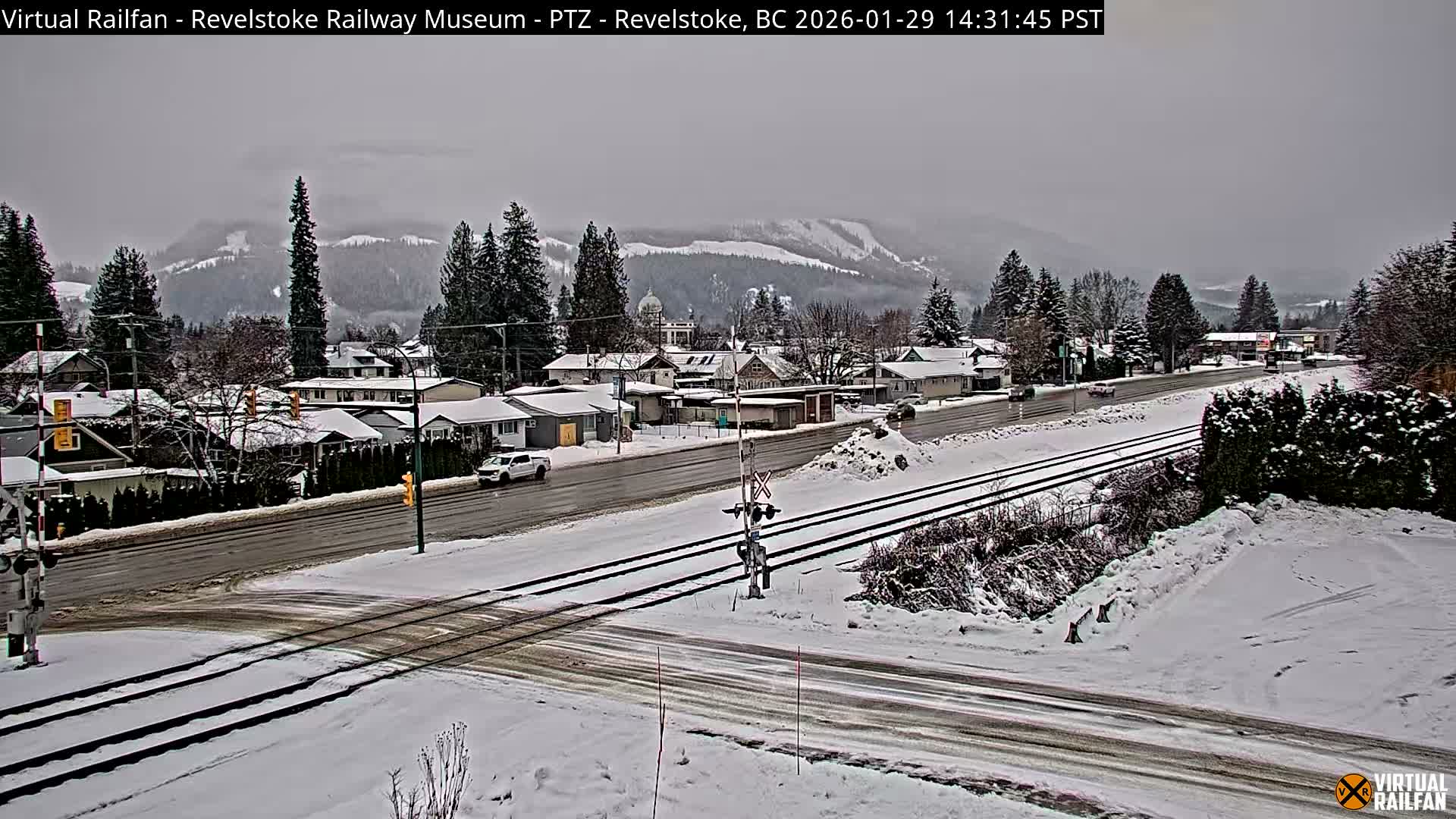 Revelstoke City & Canadian Pacific Railway Railroad Crossing Live Cam - Revelstoke, Columbia-Shuswap, British Columbia, Canada  PTZ | Virtual Railfan LIVE ! 2025-03-18 12:14