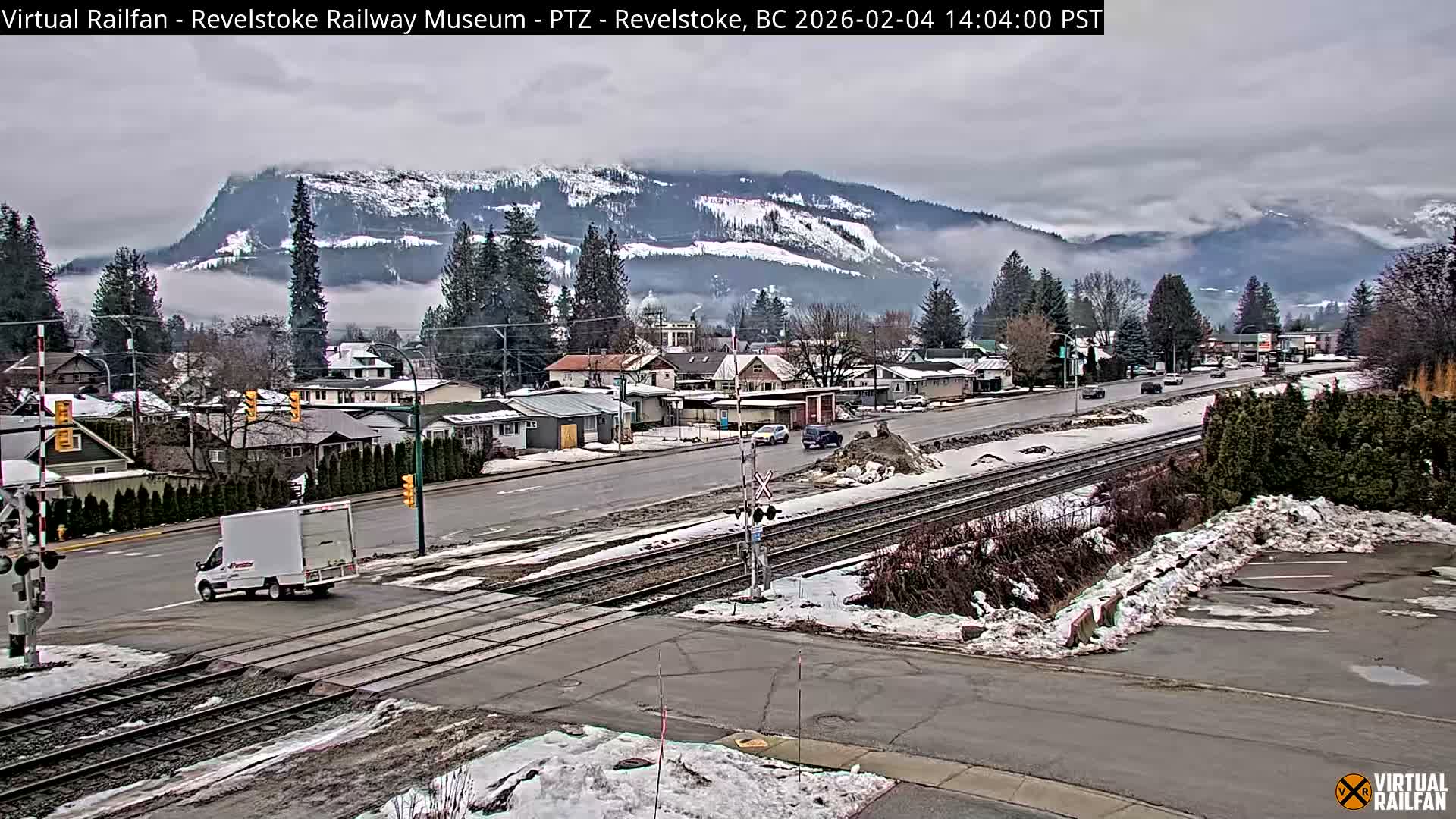 Revelstoke City & Canadian Pacific Railway Railroad Crossing Live Cam - Revelstoke, Columbia-Shuswap, British Columbia, Canada  PTZ | Virtual Railfan LIVE ! 2025-03-18 12:14