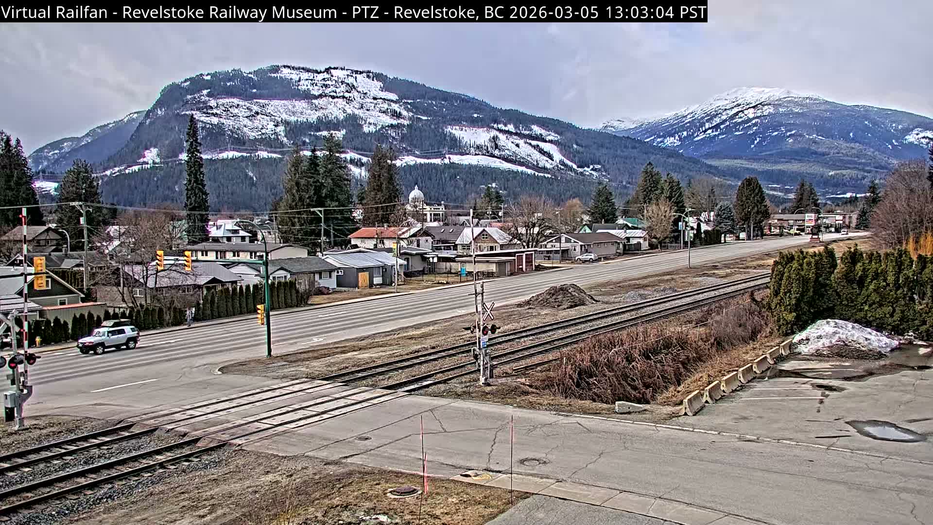 Revelstoke City & Canadian Pacific Railway Railroad Crossing Live Cam - Revelstoke, Columbia-Shuswap, British Columbia, Canada  PTZ | Virtual Railfan LIVE ! 2025-03-18 12:14