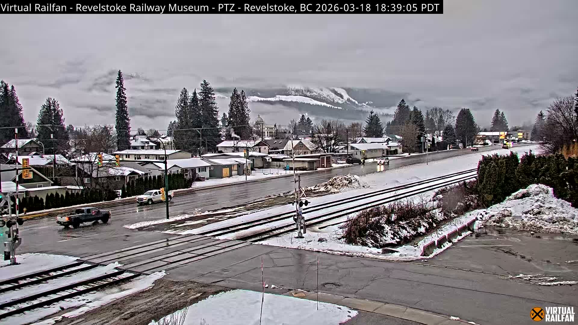 Revelstoke City & Canadian Pacific Railway Railroad Crossing Live Cam - Revelstoke, Columbia-Shuswap, British Columbia, Canada  PTZ | Virtual Railfan LIVE ! 2025-03-18 12:14