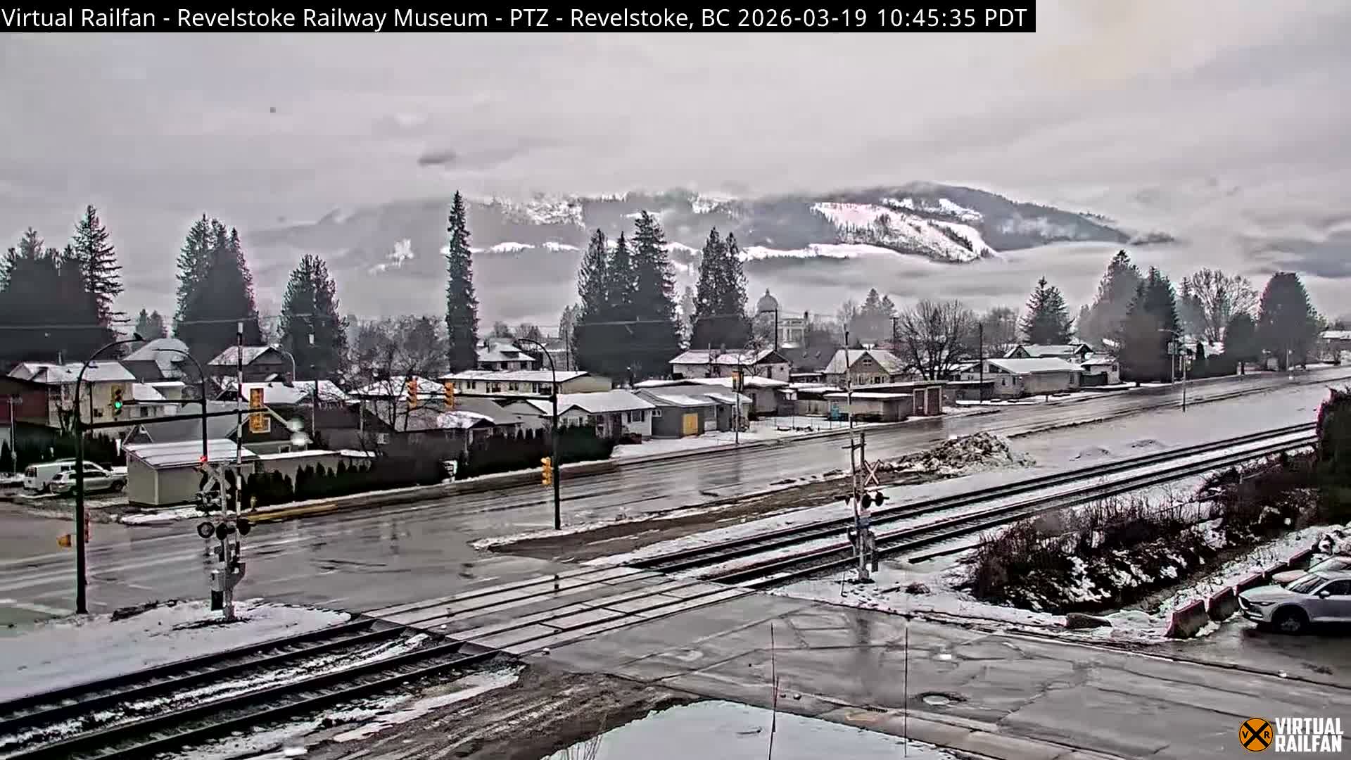 Revelstoke City & Canadian Pacific Railway Railroad Crossing Live Cam - Revelstoke, Columbia-Shuswap, British Columbia, Canada  PTZ | Virtual Railfan LIVE ! 2025-03-18 12:14