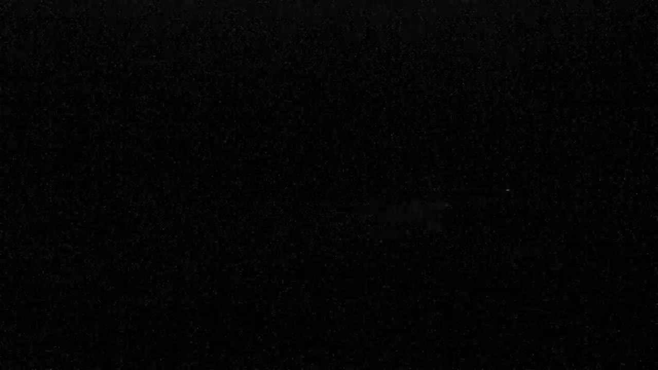 A completely black image with tiny, scattered specks of light.