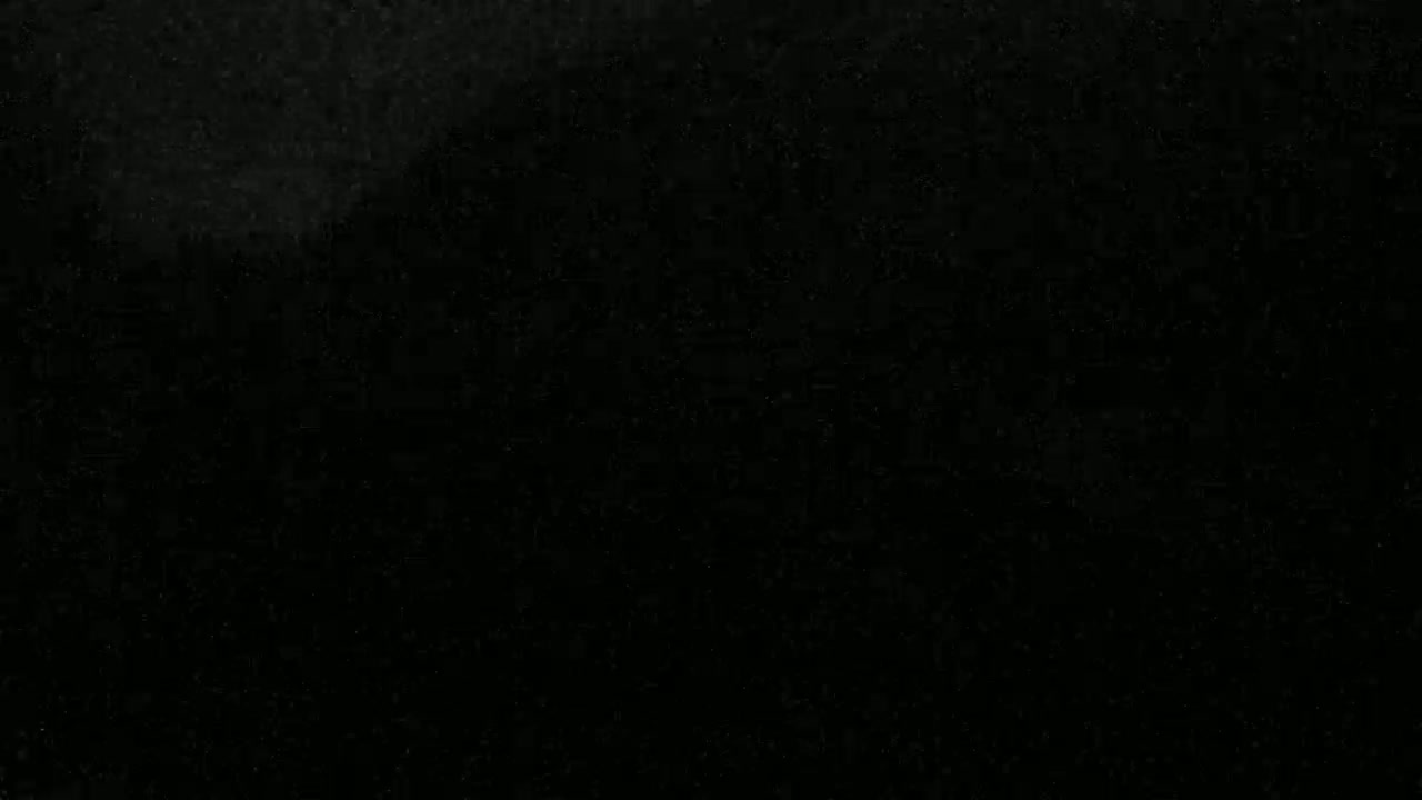 The image shows a uniformly dark, textured surface.