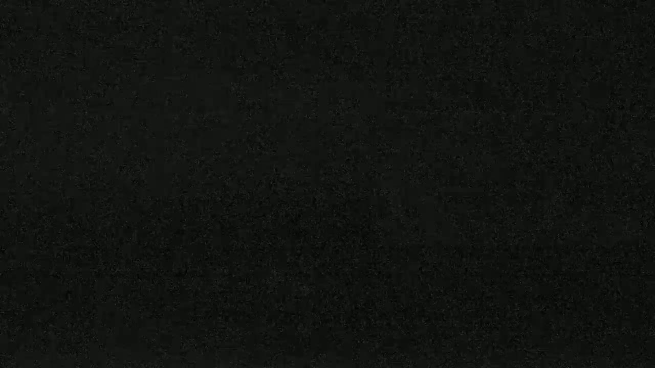 The image shows a dark, textured surface.