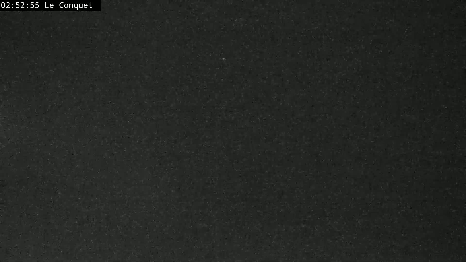 A dark gray or black textured surface is shown.