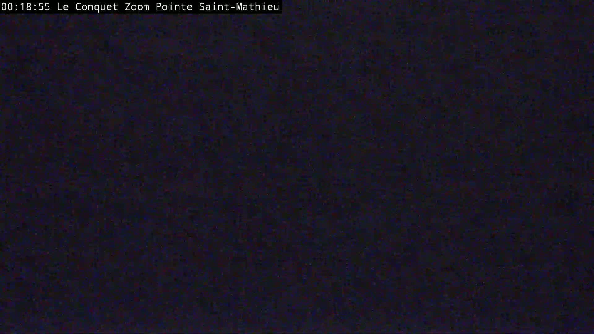 The image is a completely dark, grainy view.