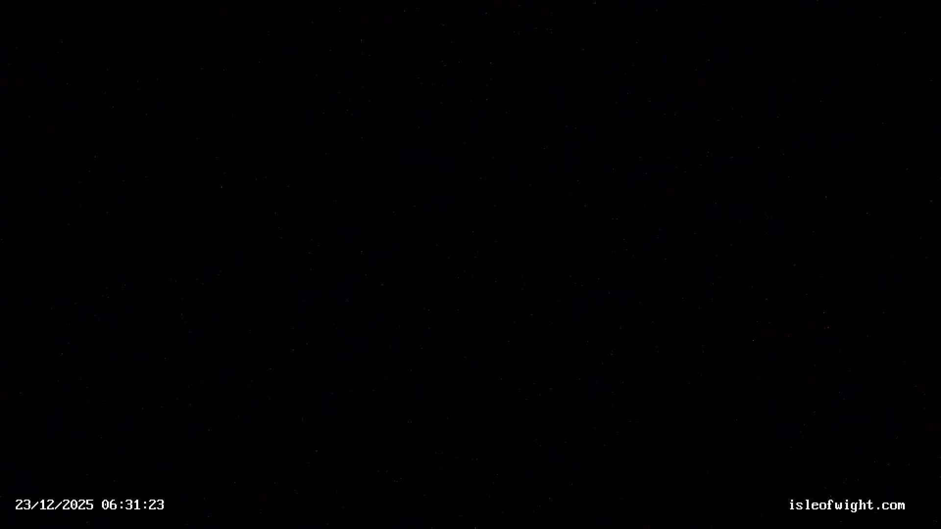 A clear, very dark night sky is visible, sparsely dotted with faint white stars.