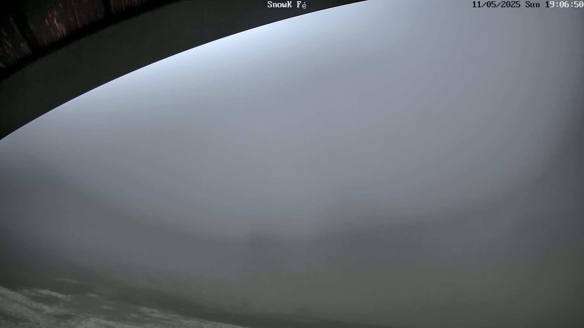 A low view shows a thick fog obscuring the landscape.