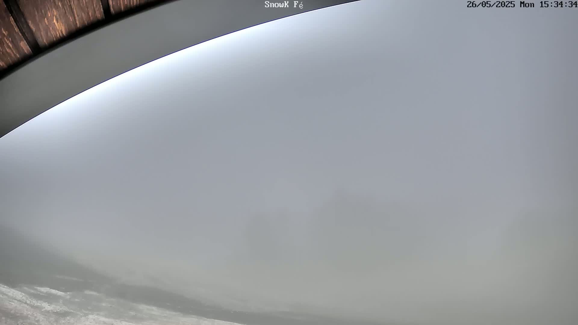 A low-angle view shows a thick fog obscuring the landscape.