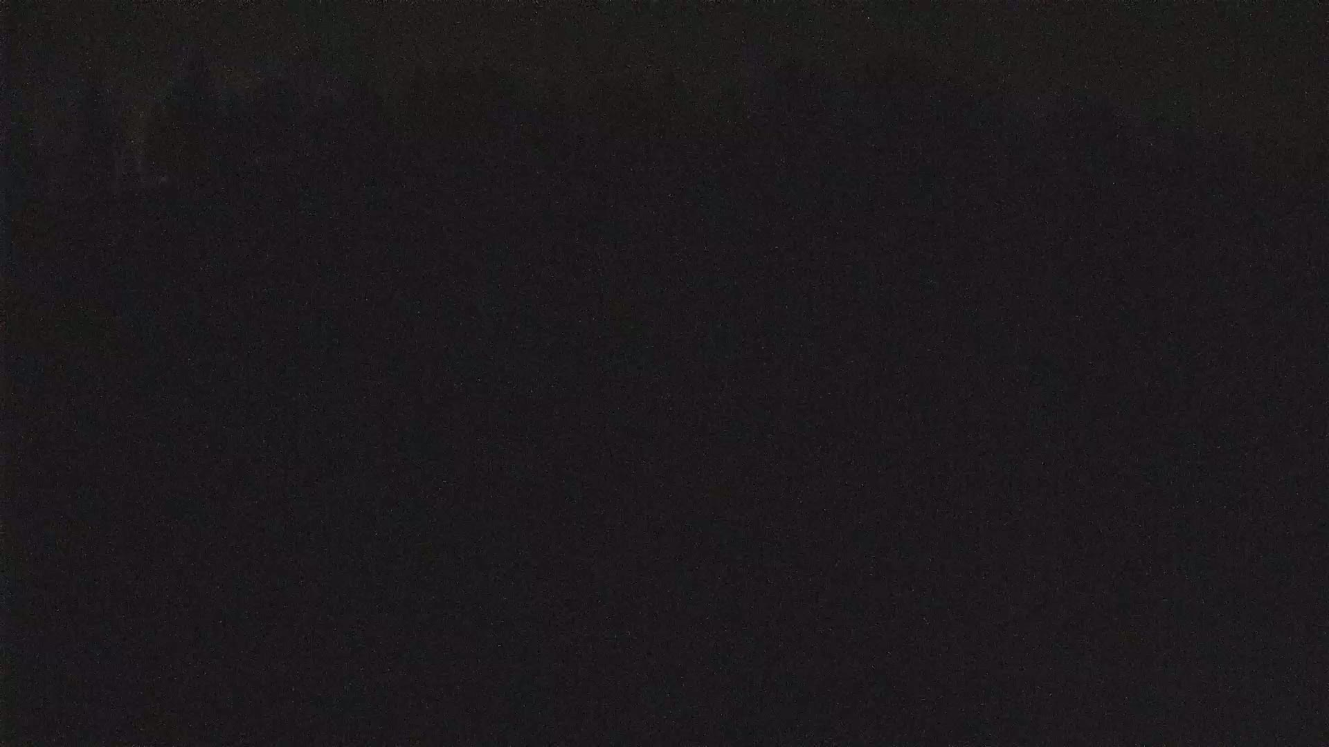The image shows a solid black surface.