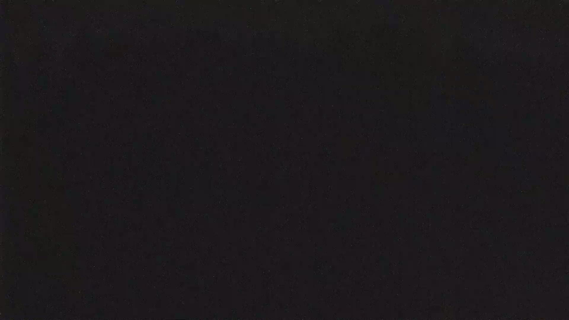 The image shows a uniformly dark gray or black surface.