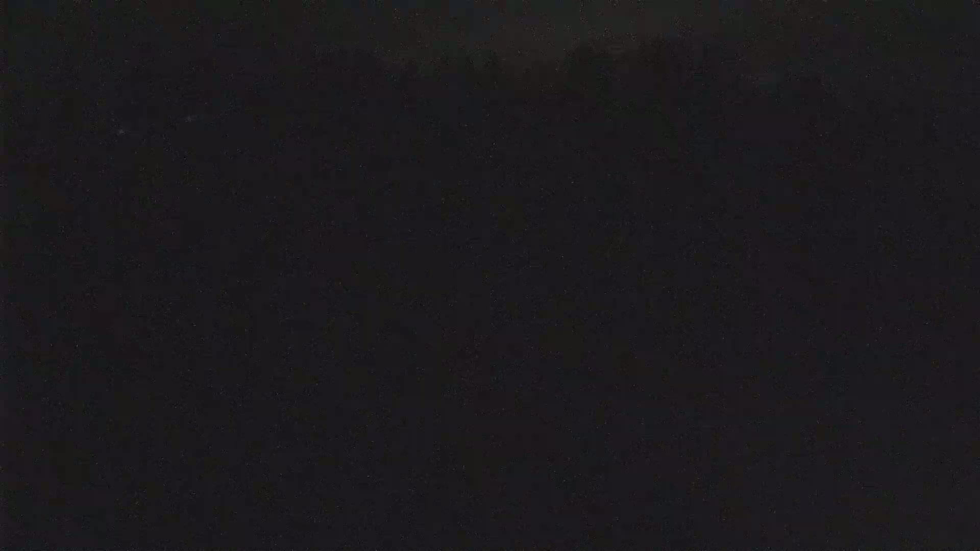 The image shows a completely dark, possibly nighttime scene.