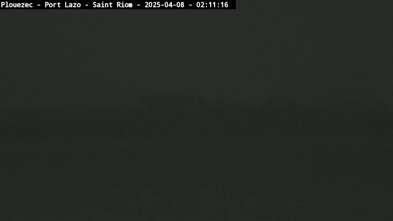 A dark, uniformly colored image shows a very dark gray or black expanse, possibly an overcast night scene.