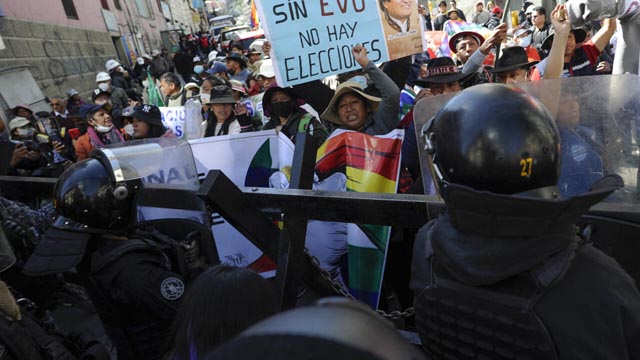 Bolivian Police Injured in Clashes with Morales Supporters Over Election Ban and Economic Crisis