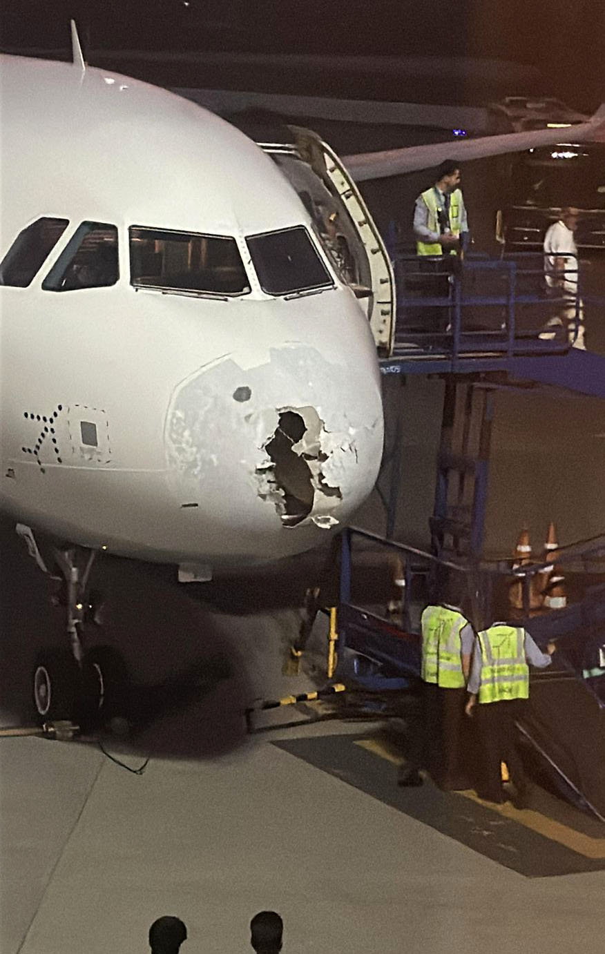 Passengers' Harrowing Flight: Plane Hit by Hail, Turbulence