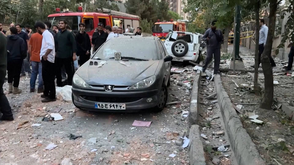 Iranian Strikes in Israel: Migrant Worker Seeks Shelter Under Overpass