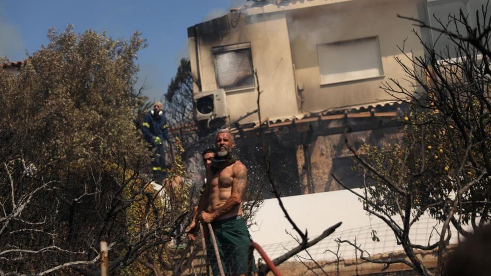 Greece Wildfire: Homes Destroyed in Coastal Towns - Latest Updates