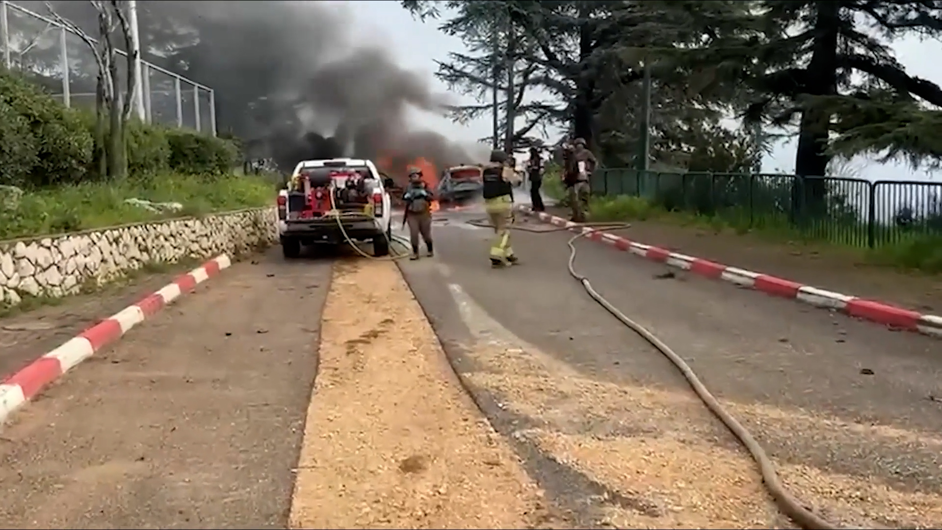 Israeli firefighters battle vehicle blaze after missile attack from Lebanon